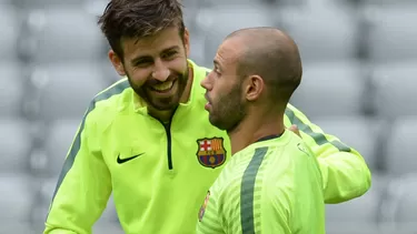 Gerard Piqué y Javier Mascherano (Foto. AFP)